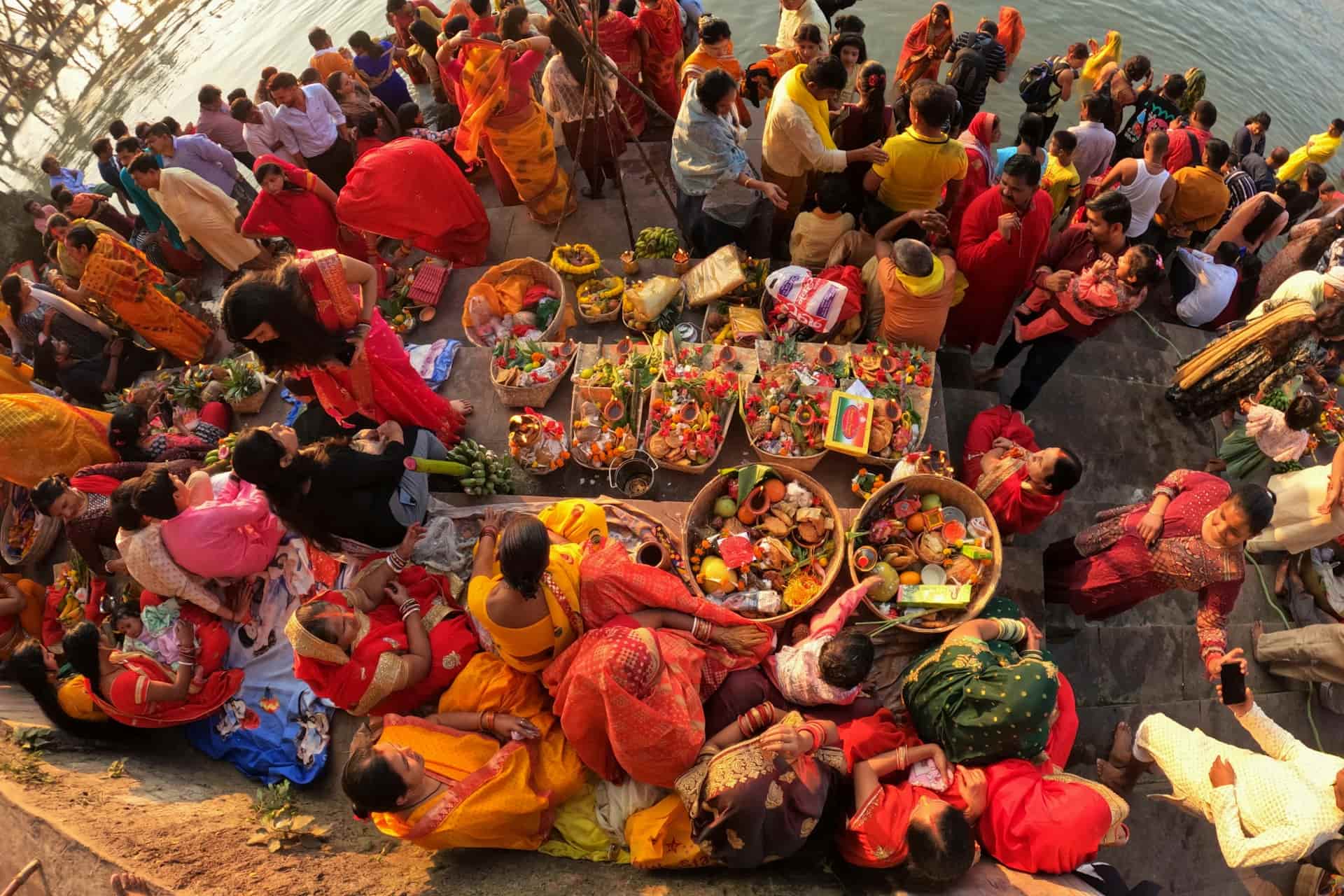 Chhath Festival Gathering: Devotees Worshipping with Trays